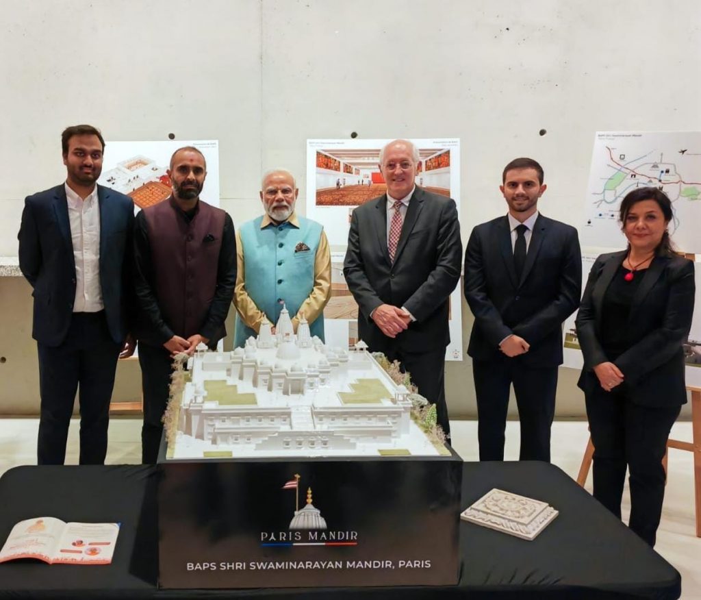 Indian prime minister Narendra Modi with BAPS volunteers and members of the architect of the upcoming temple in Paris, Arte Charpentier, during his recent visit to France in July 2023. 