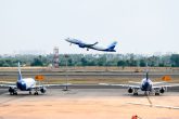 An Indigo flight takes off at an airport in India.