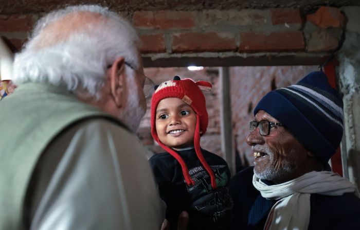 Prime Minister Narendra Modi visits the house of a Ujjwala Yojana beneficiary, in Ayodhya