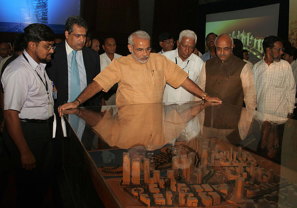 Narendra Modi, then chief minister of Gujarat, sees a model of GIFT City