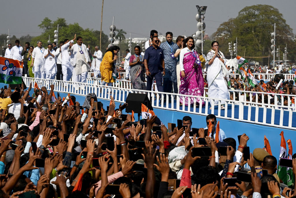 Candidates of the Trinamool Congress, an opposition party in India, walk in a ramp at a rally in Kolkata in the eastern Indian state of West Bengal