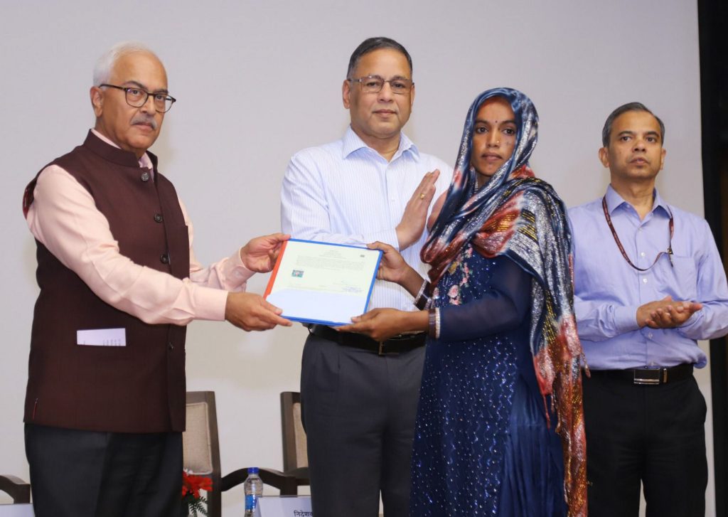 Indian home secretary Ajay Kumar Bhalla (extreme left) hands over the first set of citizenship certificates under the Citizenship (Amendment) Act (CAA), in New Delhi.