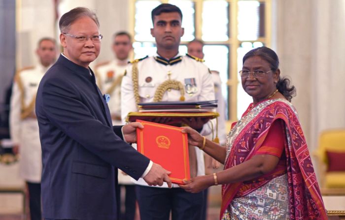 Indian president Droupadi Murmu (R) receives credentials from Chinese ambassador Xu Feihong in New Delhi.