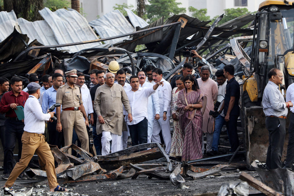 Bhupendra Patel, chief minister of the western Indian state of Gujarat, inspects the site where a deadly fire broke out on May 25, killing 27 people.