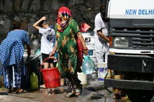 People fetch water in extreme heatwave in New Delhi, India.