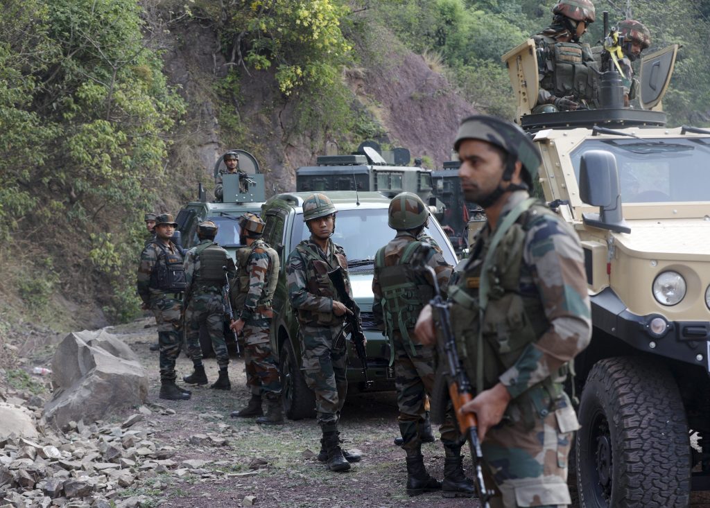 Security personnel at the site in Jammu and Kashmir, India, where terrorists opened fire on a bus carrying pilgrims