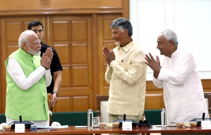 Indian PM Narendra Modi with two of his National Democratic Alliance allies N Chandrababu Naidu (C) and Nitish Kumar (R)