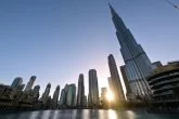 The sun sets behind the Burj Khalifa in Dubai, UAE Budget