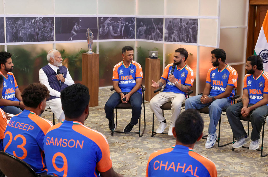 Indian PM Narendra Modi speaks with the India cricket team players and coach Rahul Dravid after they won the T20 World Cup 2024